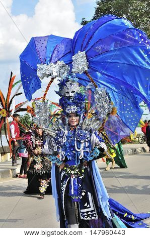 Tenggarong Indonesia - October 27th 2012: carnival with unique costumes on public roads within distance 4 km and is held every year in east borneo indonesia