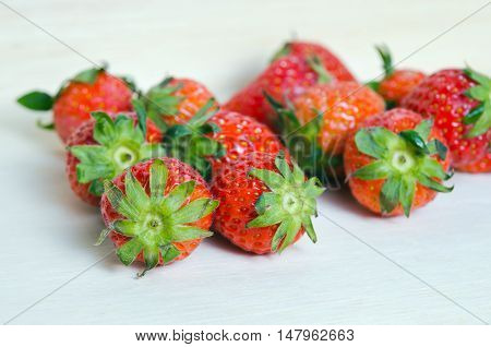 Group Of Of Red Ripe Strawberry Fruit On Wooden Board (also Known As Fragaria Strawberry, Fragaria A