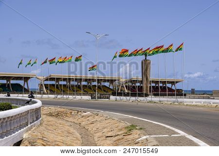 Accra,ghana - April 11 2018: Looking Across Roundabout Towards The Seating And Flags Of Ghana In Ind