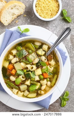 Fresh Homemade Vegetable Soup Made Of Zucchini, Celery, Carrot, Peas, White Beans, Green Beans, Pota