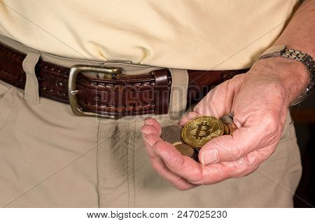 Concept Of Bitcoin Or Cyber Currency Only Worth As Much As Loose Change In Mans Hand
