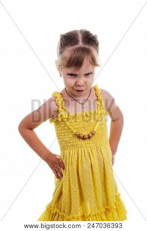 Children's Emotions: Angry Little Girl In A Yellow Dress