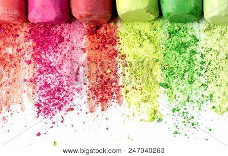 Crumbs And Chunks Of Multicolored Chalk, Pastels On White Paper For Watercolor. Yellow, Pink, Red, G