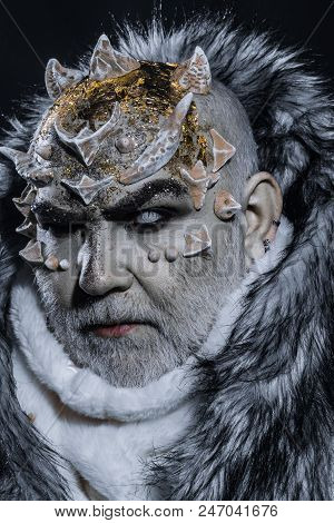 Demon On Black Background, Close Up. Dark Arts Concept. Senior Man With White Beard Dressed Like Mon