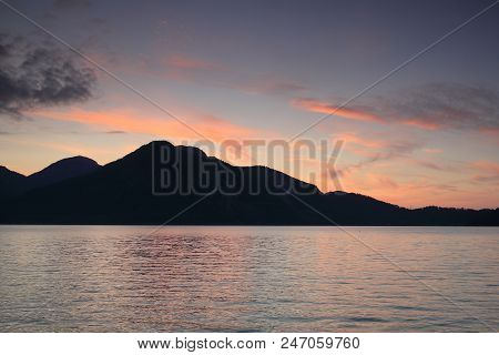 Beautiful Sundown On A Lake In Bavaria With Mountains In Background