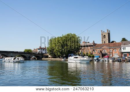 Skyline Of Henley On Thames In Oxfordshire Uk With River Thames In Foreground