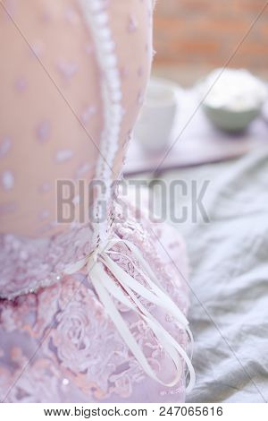 Closeup Back Of Bride Wearing Dress. Concept Of Bridal Clothe Elements.
