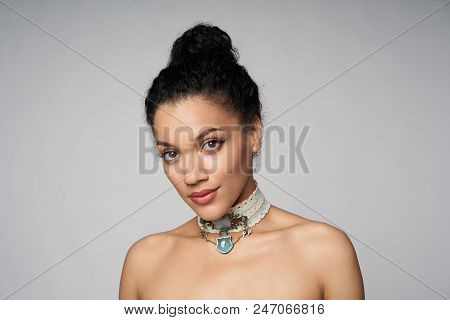 Beauty Closeup Portrait Of Beautiful Mixed Race Woman Wearing Chocker Posing, Isolated On Gray Backg