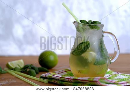 Cold Summer Drink, Lemonade With Lime And Basil On The Basis Of Sparkling Water And Sugar Syrup In A