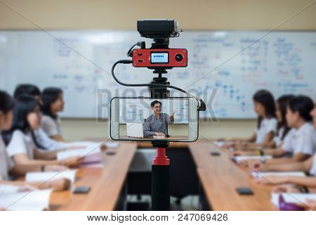 Closeup Smart Mobile Phone Taking Live Of Asian Teacher In The Classroom,camera For Photographer Or 