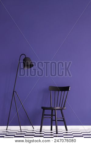 Black Lamp And Chair Set On A Violet Wall. Place Your Product