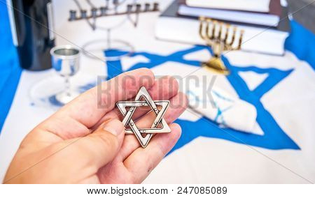 Hand Holding A David Star (