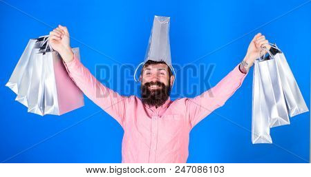 Man With Long Beard And Funny Look Isolated On Blue Background. Hipster With Trendy Beard Shopping D
