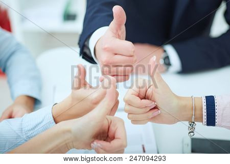 Hands Of Business Team With Tumbs Up.