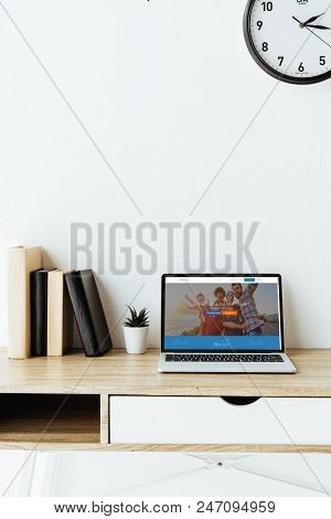 Laptop With Couchsurfing Website On Screen On Work Table At Office