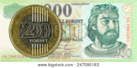 200 Forint Coin Against 200 Hungarian Forint Bank Note Obverse