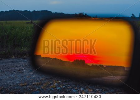 Sunset Reflection In The Side Mirror Of The Car