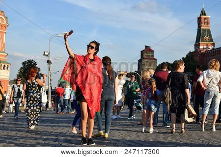 Moscow, Russia - June 26, 2018: Moroccan Football Fan Girl Takes Selfie On The Background Of The Kre