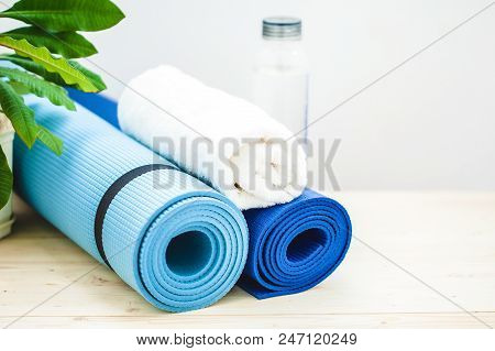 Set For Sports, A Yoga Mat, A Towel, A Bottle Of Water On A Light Background. The Concept Of A Healt