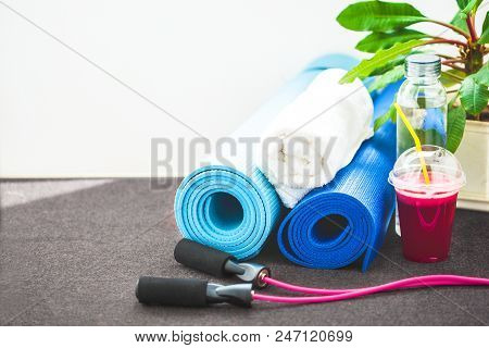 Set For Sports, A Yoga Mat, A Towel, Smoothies, Jumping Rope, A Bottle Of Water. The Concept Of A He