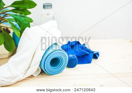 Set For Sports, A Yoga Mat, A Towel And A Bottle Of Water On A Light Background. The Concept Of A He