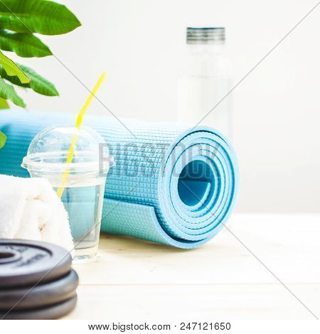 Set For Sports, Towel, Dumbbell And A Bottle Of Water On A Light Background The Concept Of A Healthy