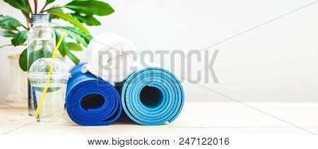 Set For Sports, Blue Yoga Mat Towel And A Bottle Of Water On A Light Background The Concept Of A Hea