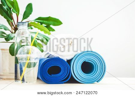 Set For Sports, Blue Yoga Mat Towel And A Bottle Of Water On A Light Background The Concept Of A Hea