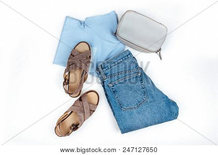 Stylish Female Clothes Set. Girl Outfit On White Background. Blue Jeans, Bag, T-shirt, Sandals. Flat