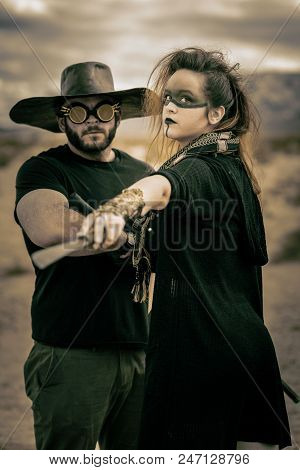In A Post-apocalyptic Desert Wasteland, Two Queens Lead Their Militias Against Each Other. Armed To 