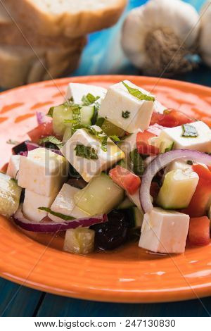 Greek salad with feta cheese cubes and fresk vegetables