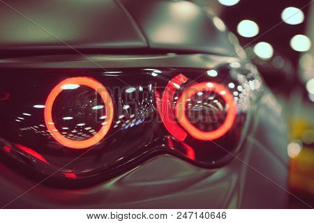 Luxury Car Headlight Close-up. Concept Of Expensive, Sports Auto.  The Concept Of Tuning. Headlight 