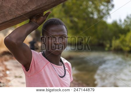 Cacheu, Republic Of Guinea-bissau - February 1, 2018: Portrait Of A Young Fisherman At The Port Of T