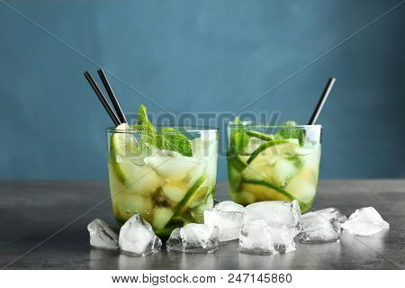 Delicious Mint Julep Cocktail In Glasses On Table