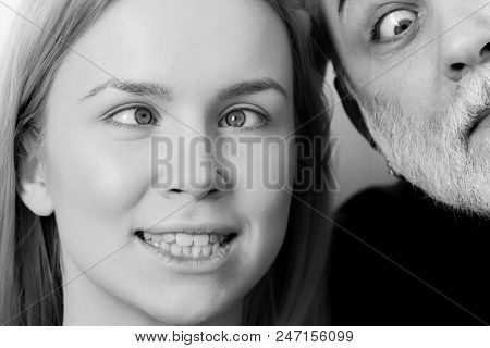 Girl Is Twisted. Girl And Man Squinting Eyes On Silly Faces. Young Woman With Crossed Grey Eyes And 