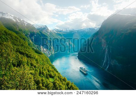 Breathtaking view of Sunnylvsfjorden fjord and famous Seven Sisters waterfalls, near Geiranger village in western Norway.