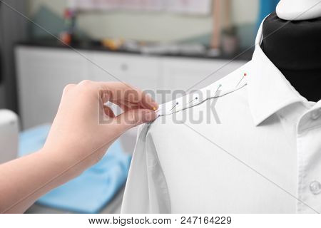 Seamstress Putting Pins Into Semi-ready Shirt In Tailor Workshop, Closeup
