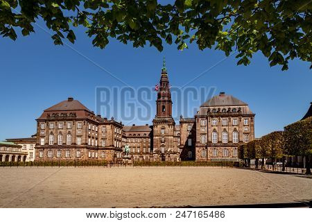 Urban Scene With Historical Christiansborg Palace And Blue Sky In Copenhagen, Denmark