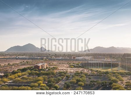 High aerial view of Scottsdale Arizona facing west towards Camelback Mountain near the 101 Highway.  