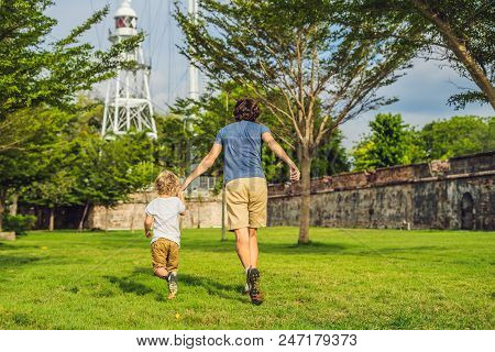 Dad And Son On Background Of Fort Cornwallis In Georgetown, Penang, Is A Star Fort Built By The Brit