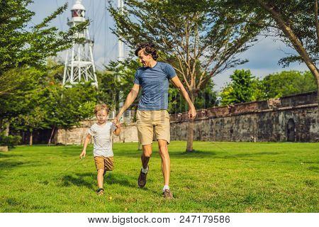 Dad And Son On Background Of Fort Cornwallis In Georgetown, Penang, Is A Star Fort Built By The Brit