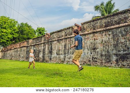 Dad And Son On Background Of Fort Cornwallis In Georgetown, Penang, Is A Star Fort Built By The Brit
