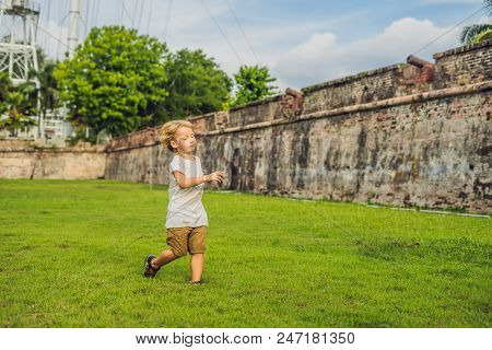 Boy On Background Of Fort Cornwallis In Georgetown, Penang, Is A Star Fort Built By The British East