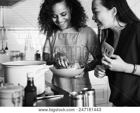 Diverse women cooking in the kitchen