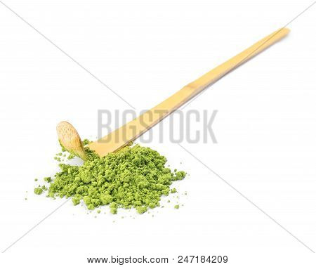 Powdered Matcha Tea And Bamboo Chashaku On White Background