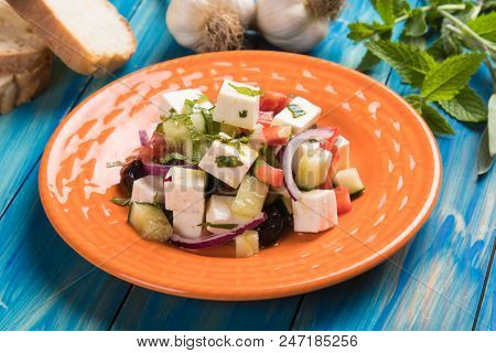 Greek salad with feta cheese cubes and fresk vegetables