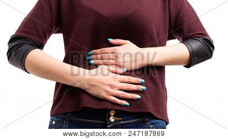 Close-up Of Young Woman Hands Holding Painful Stomach.