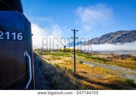 Train In Mountain Fields Landscape, New Zealand Alps