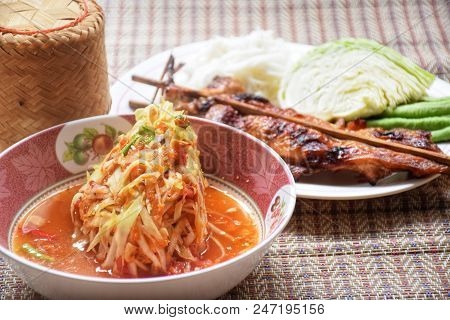 Green Papaya Salad With Grilled Chicken On Original Thailand Mat.