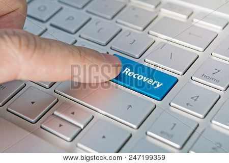 Recovery Word On Red Keyboard Button. Inscriptions On The Grey Silver Keyboard Button Close Up